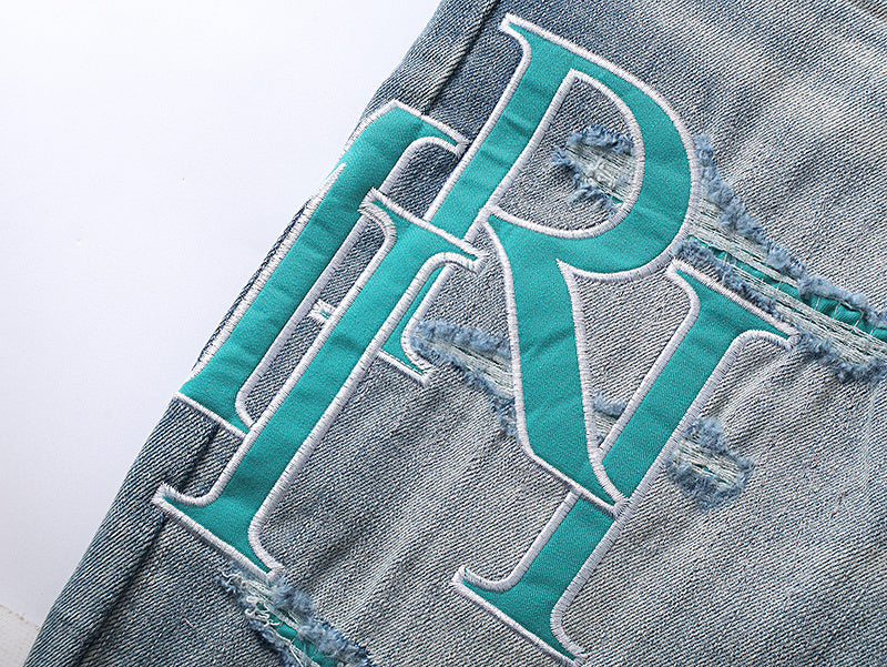 JEAN SKINNY AMIRI LOGO DÉCALÉ BLEU | L'Art de l'Asymétrie